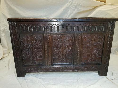 Seventeenth century carved oak three panelled coffer