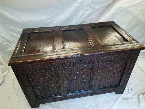 Seventeenth century carved oak three panelled coffer