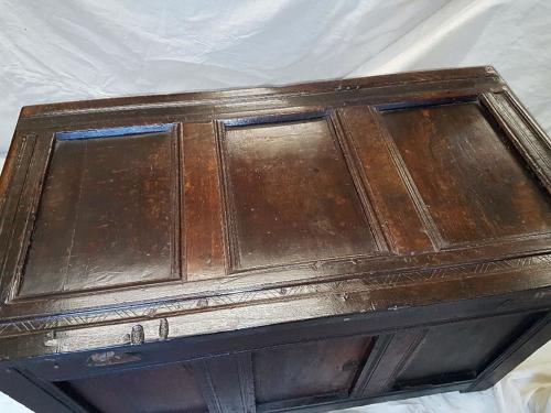 Seventeenth century carved oak three panelled coffer
